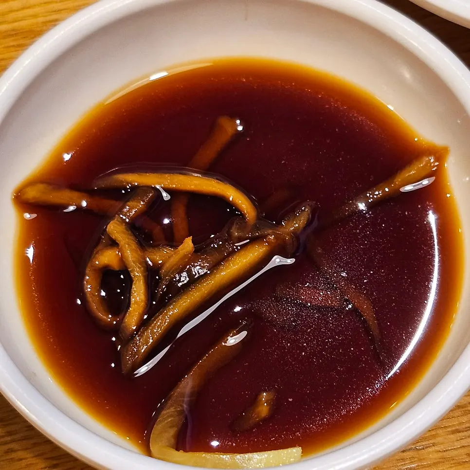 A plate of jasai pickled mustard greens