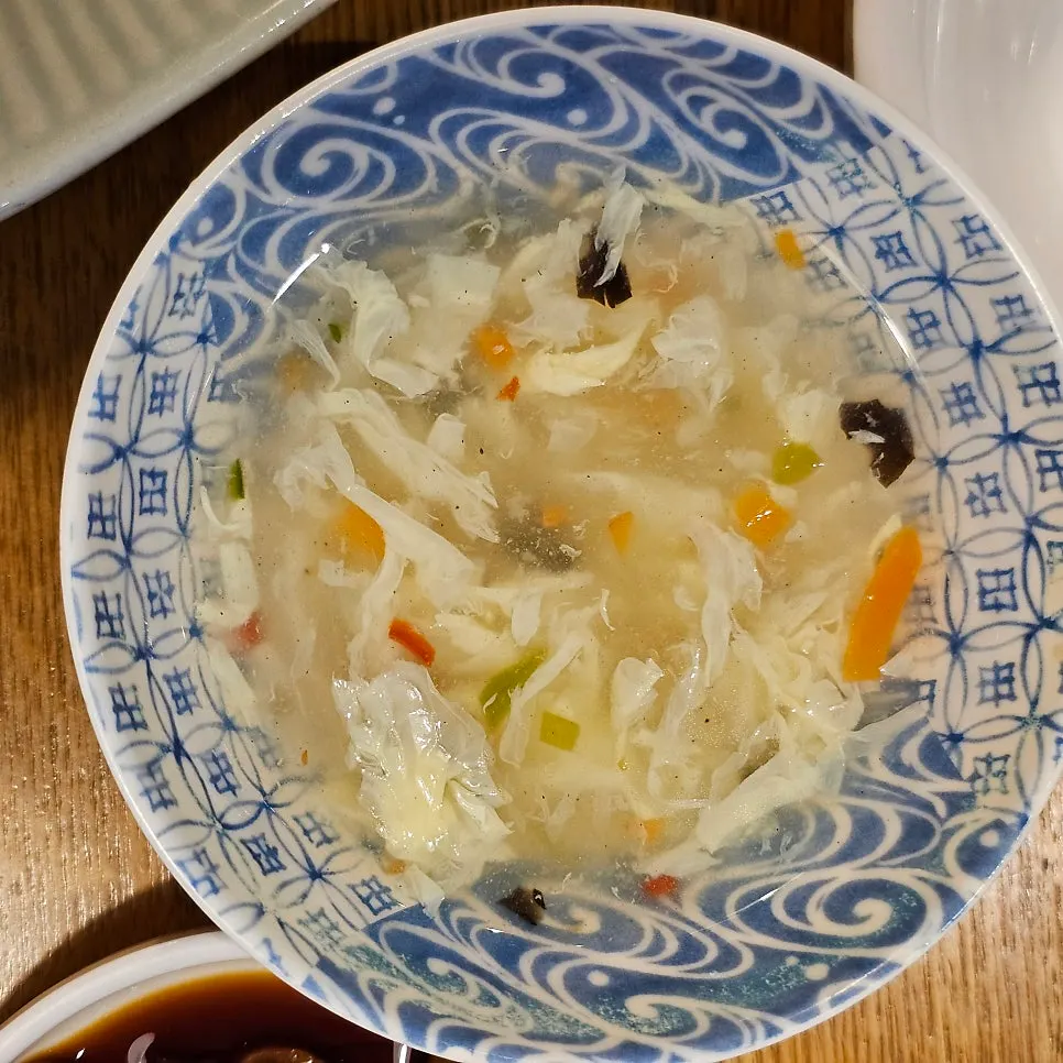 Egg drop soup served alongside the shrimp fried rice