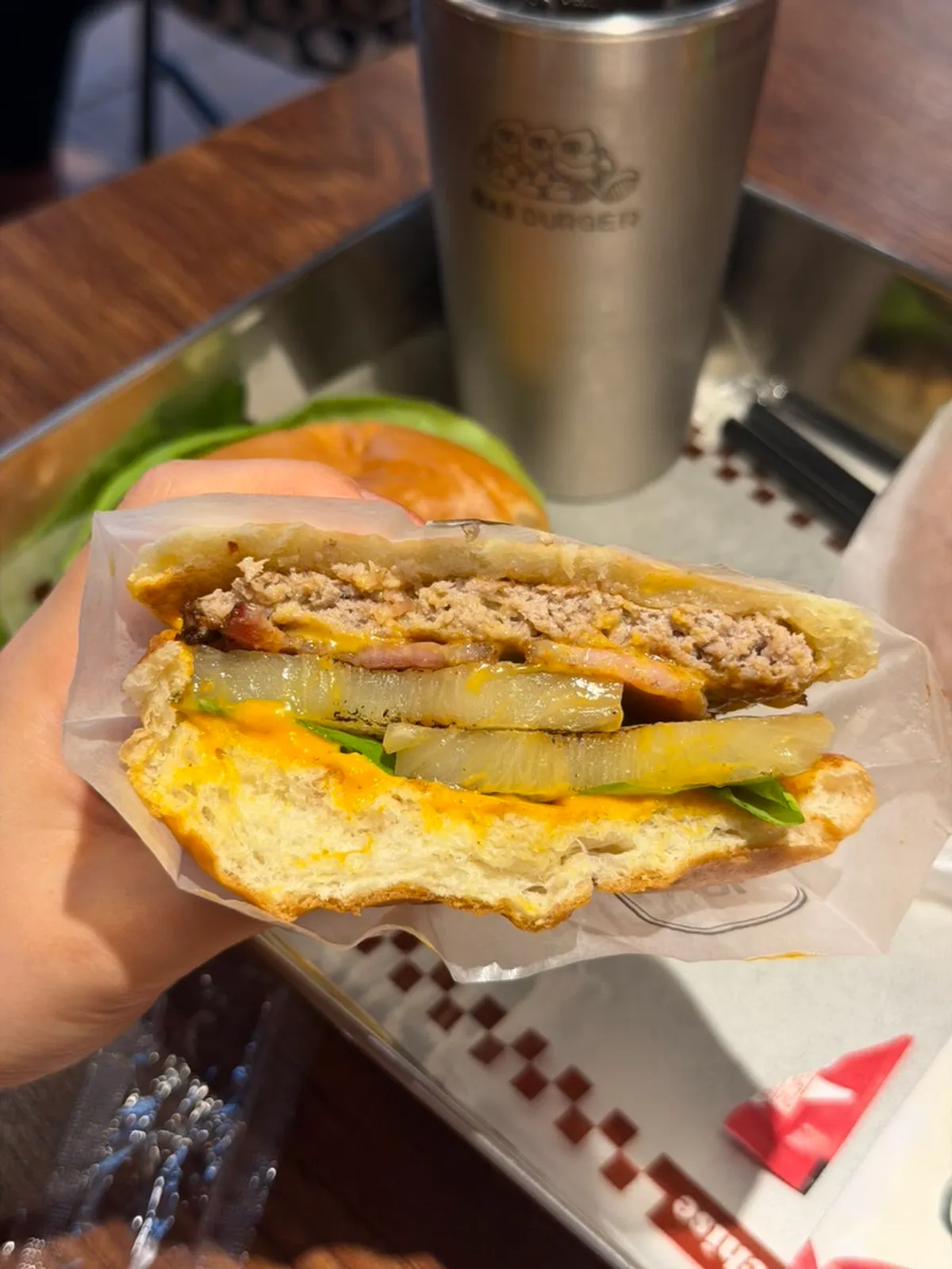 Close-up of the Hawaiian Burger showing the beef patty and pineapple
