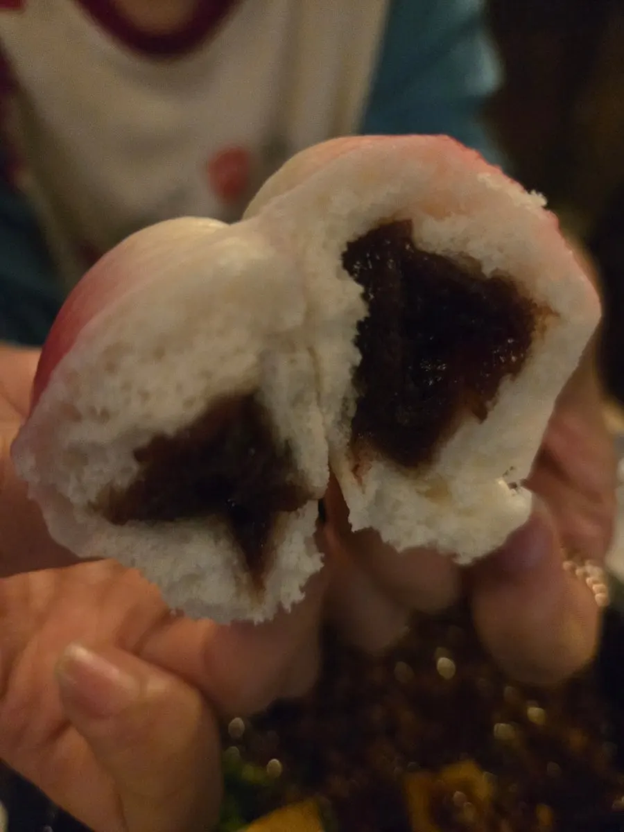 Close-up of the peach-shaped dessert