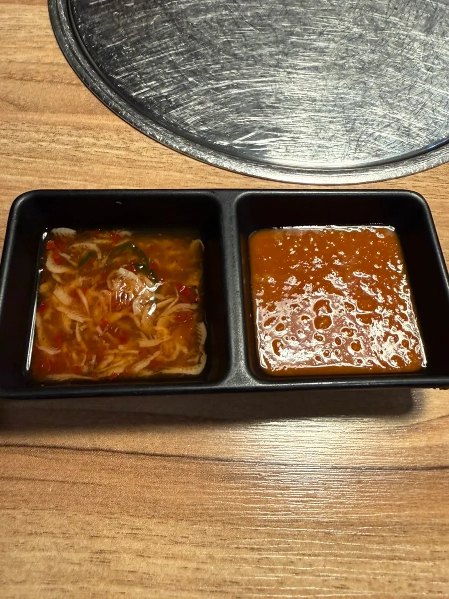 Plate of lettuce, perilla leaves, napa cabbage and other wrap vegetables