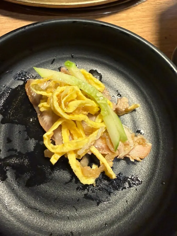 A piece of cold jokbal mixed with tangy sauce