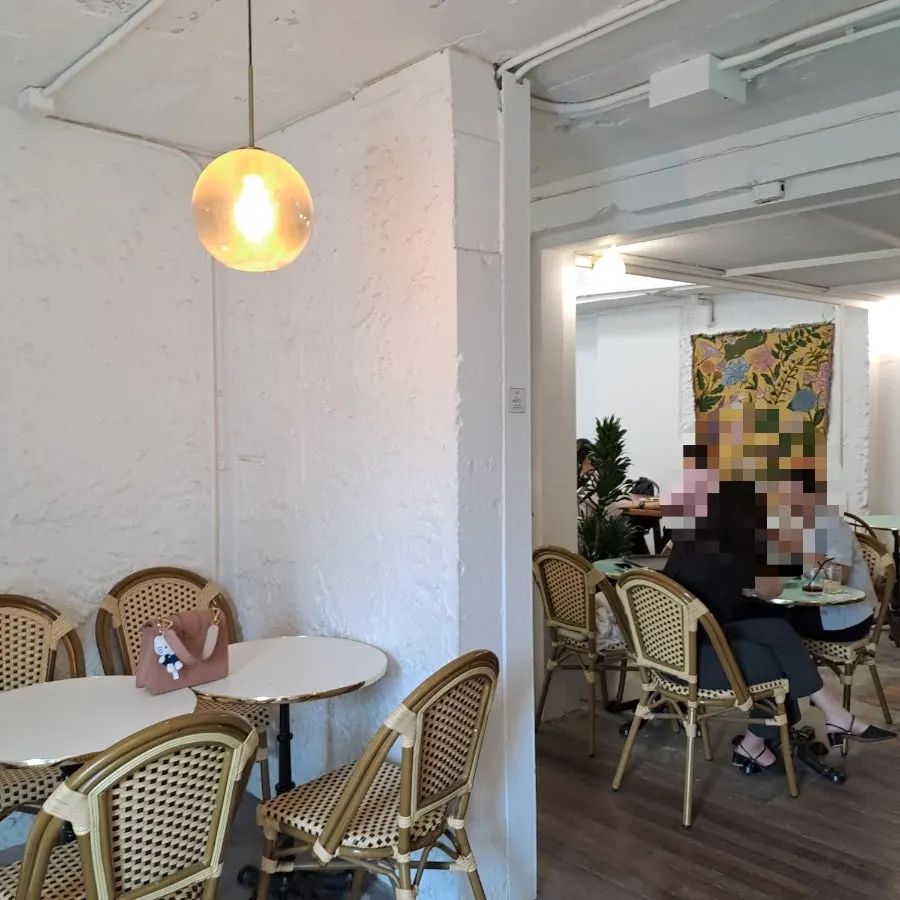White-toned 2nd floor seating filled with natural light