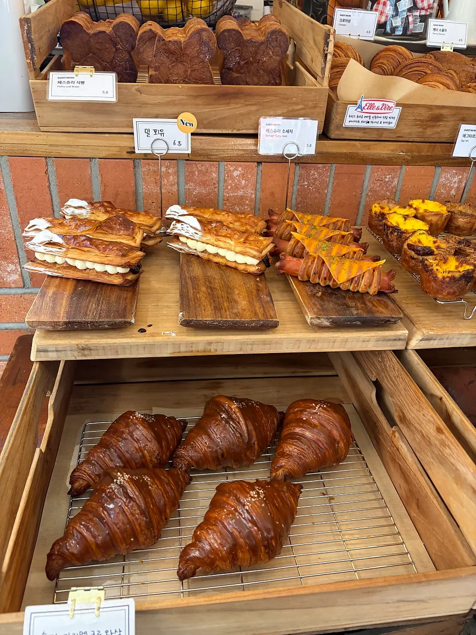 Egg tarts, mille-feuille, and other desserts on display