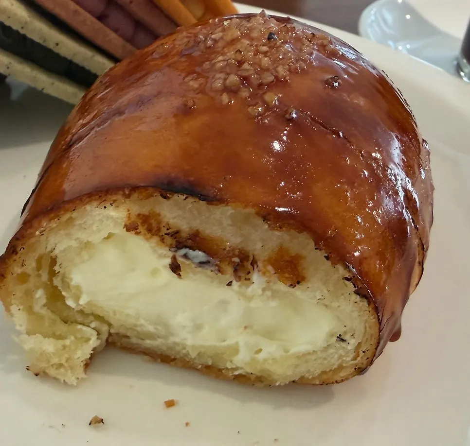 Cross-section of cream brûlée salt bread showing the cream filling