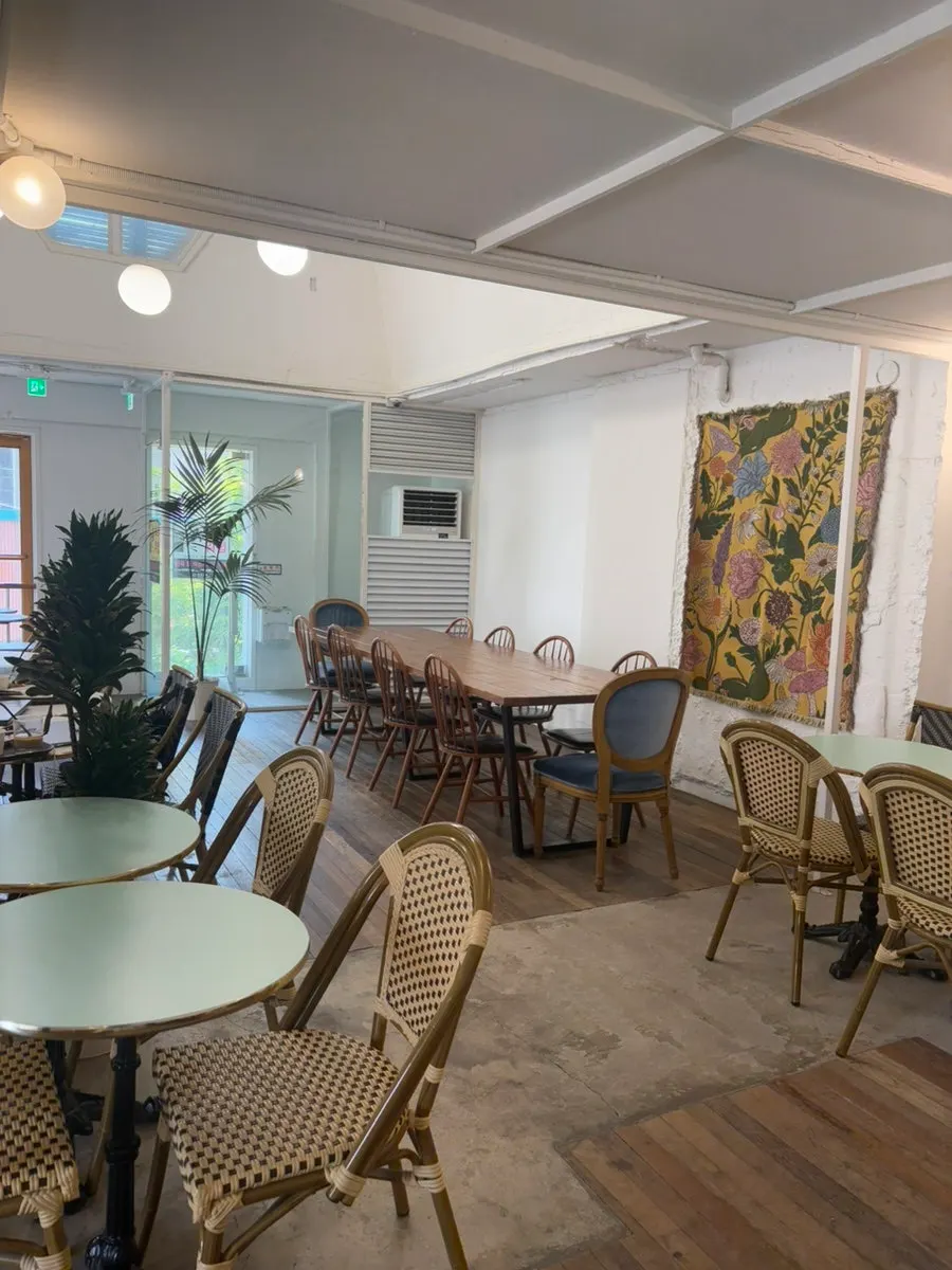 Dessert café interior decorated with an open dresser