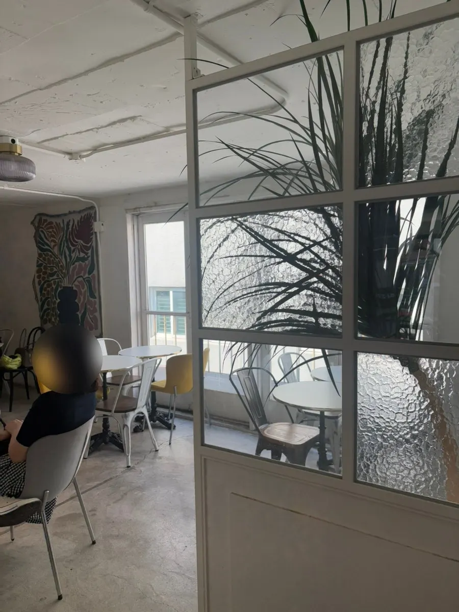 2nd-floor seating with white tones and natural light