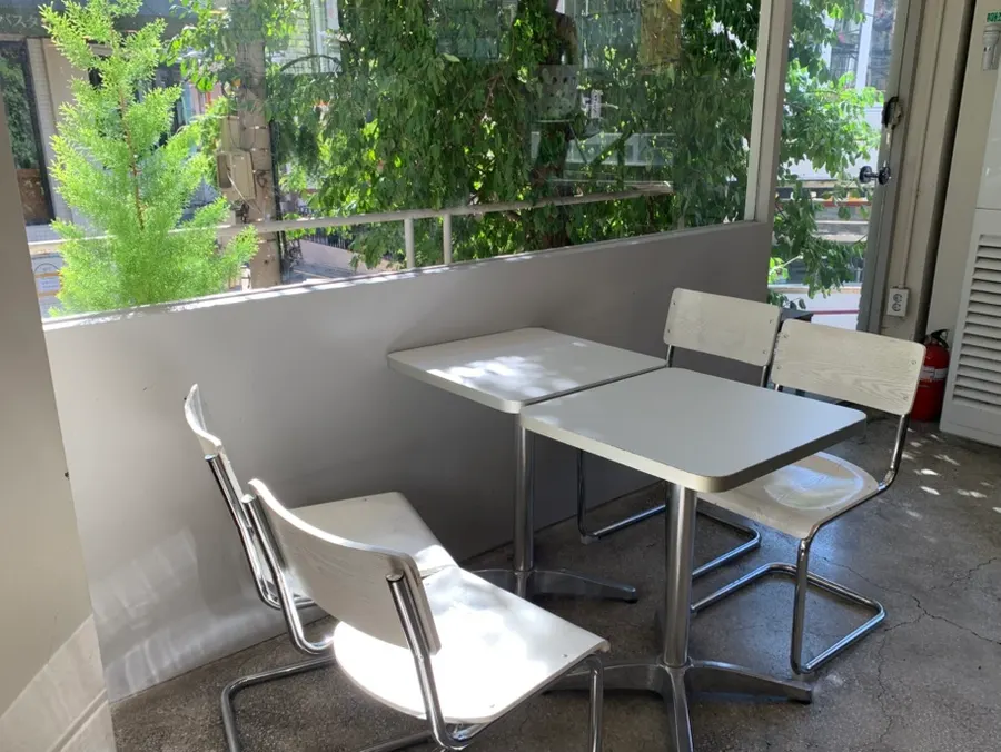 Interior of Upper and Under with a tree visible through the window