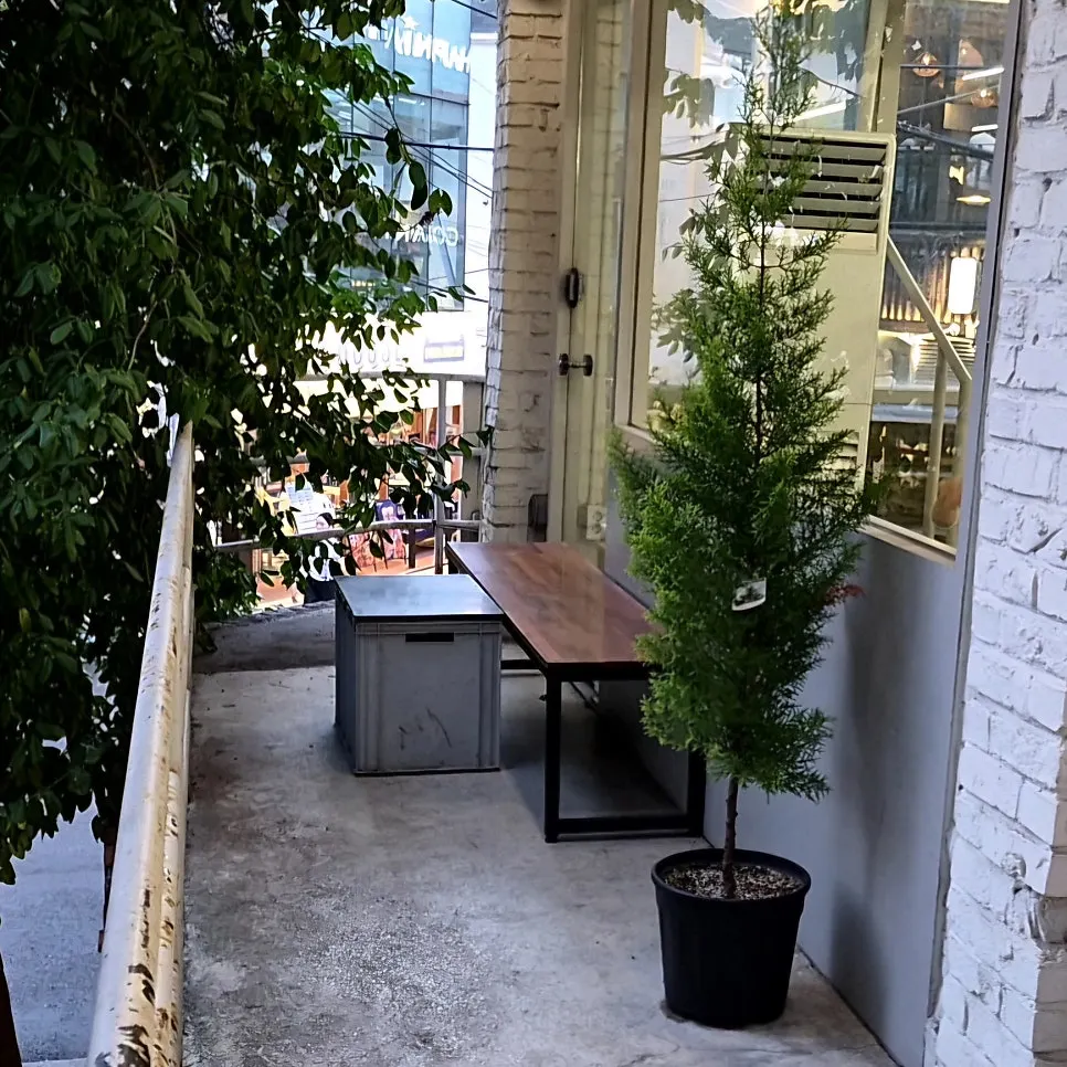 Outdoor terrace seating at Upper and Under