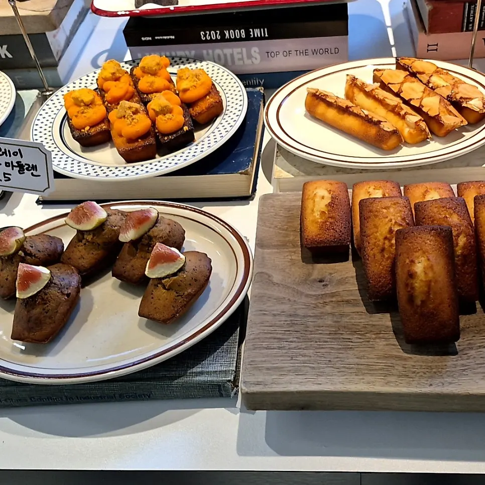 Close-up of canelés and other bakery items