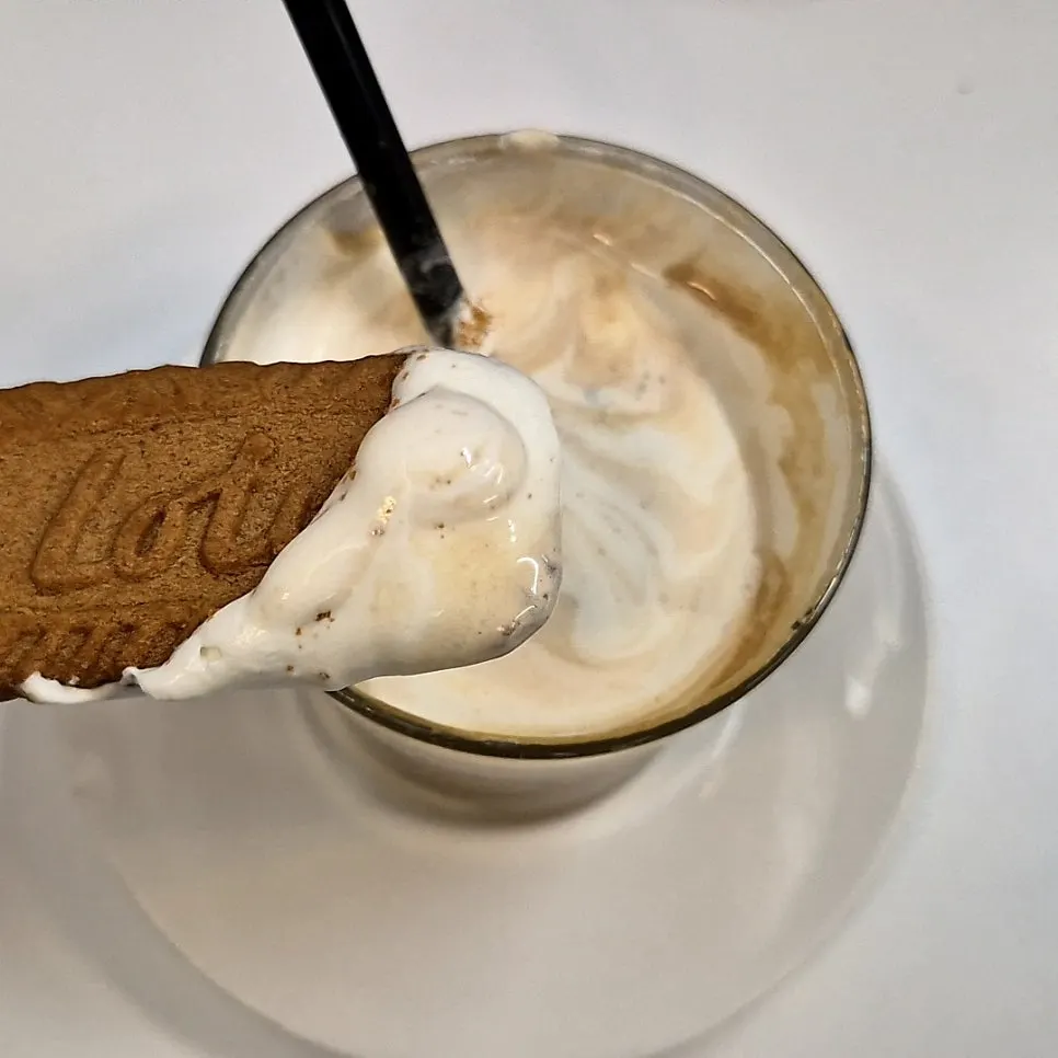 Salty caramel topped with Lotus biscuit and cream