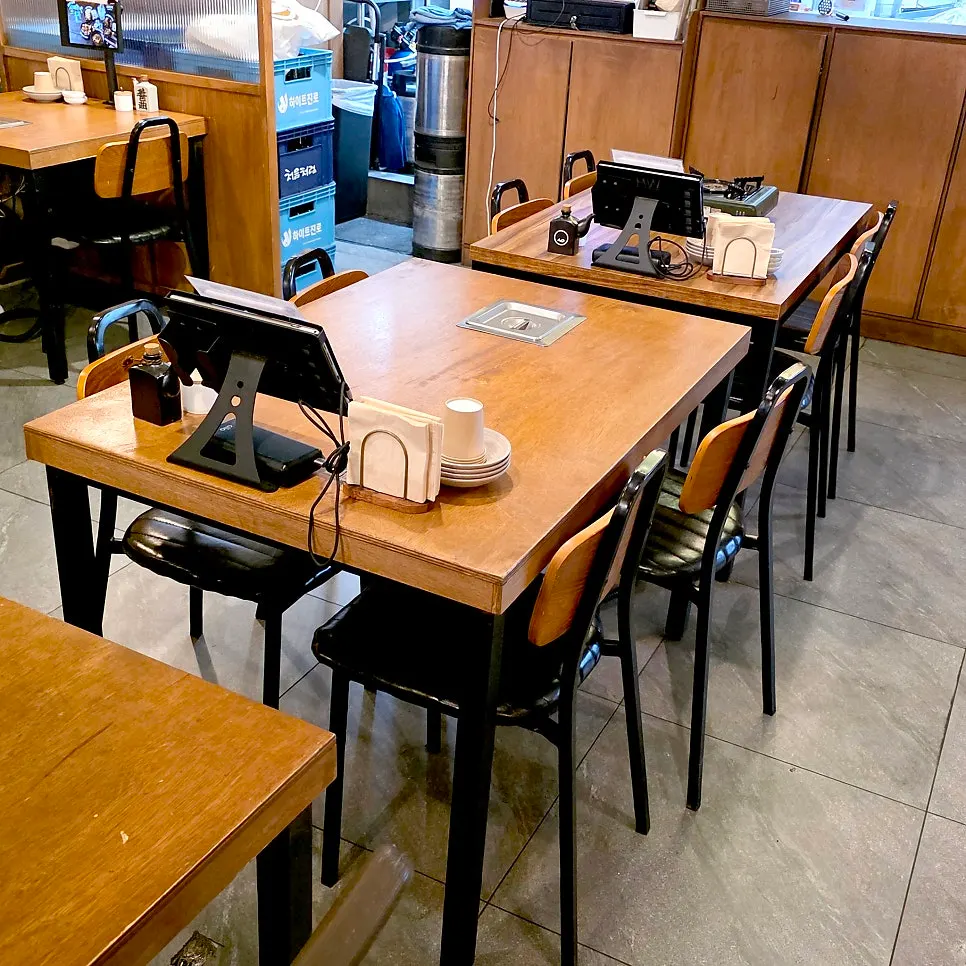 Spacious hall with wood-toned interior at Odeng Osaek Gangnam Station Branch