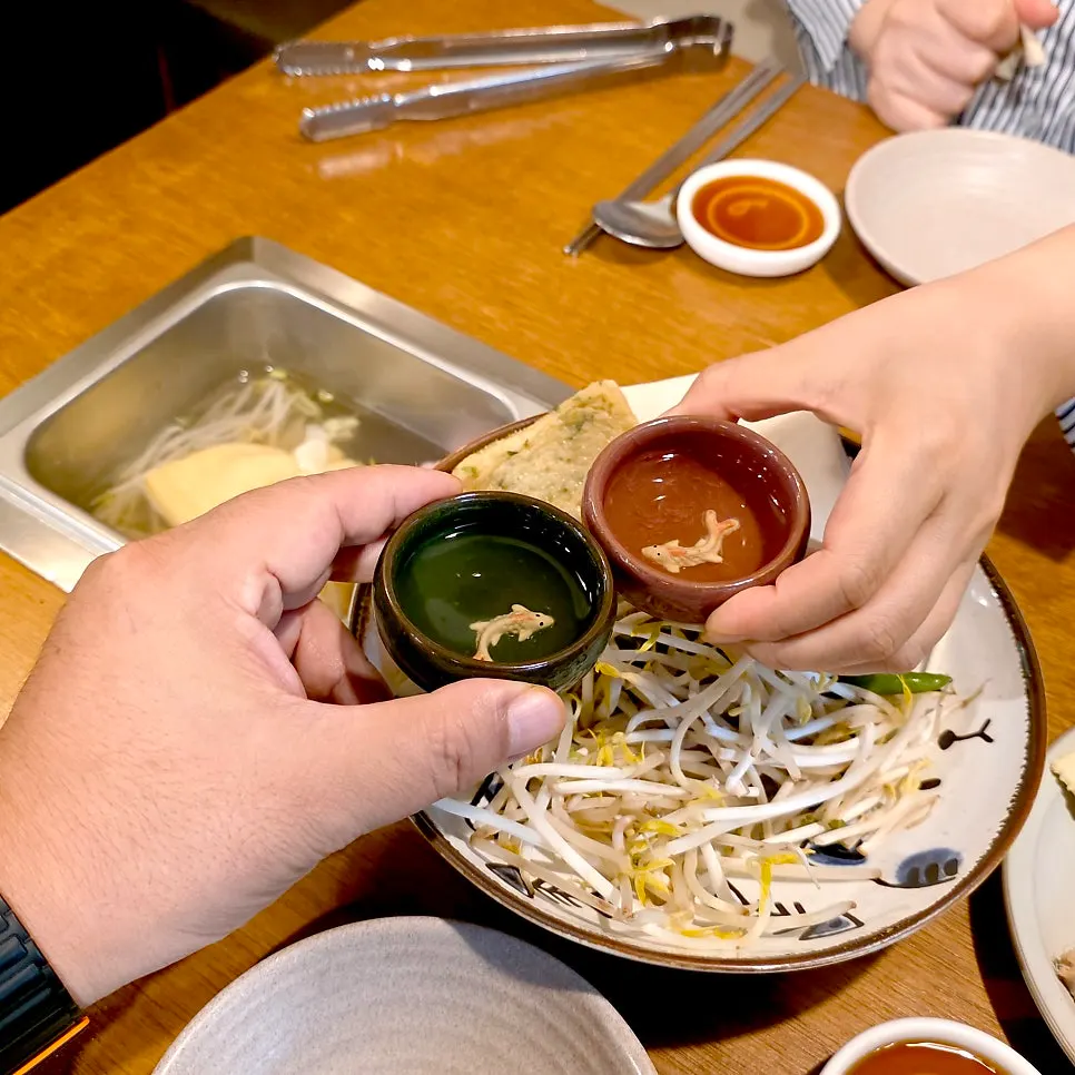 Warm oden broth enjoyed with sake