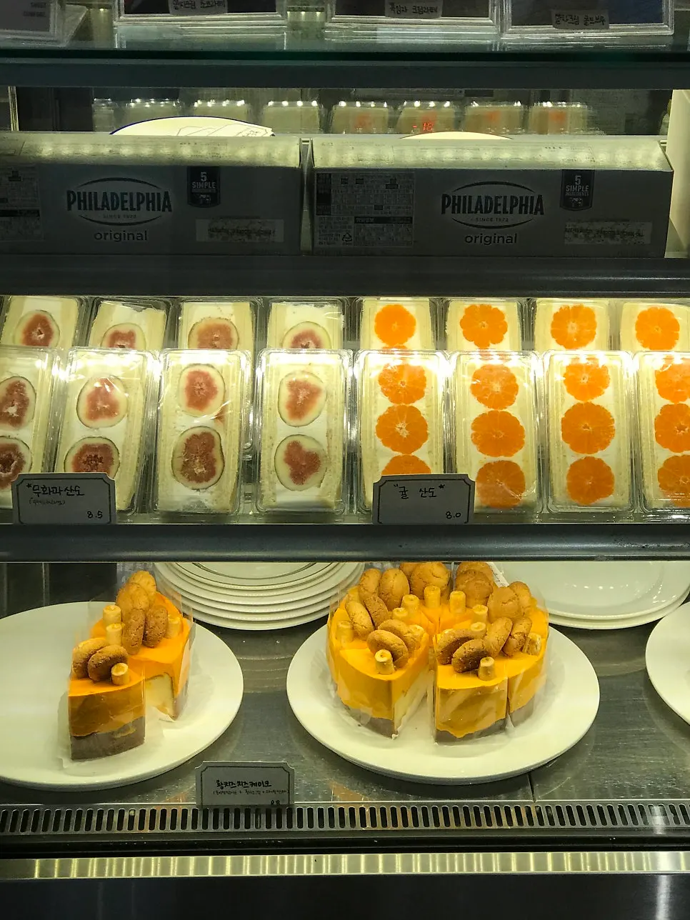 Seasonal fruit sandos in a refrigerated showcase