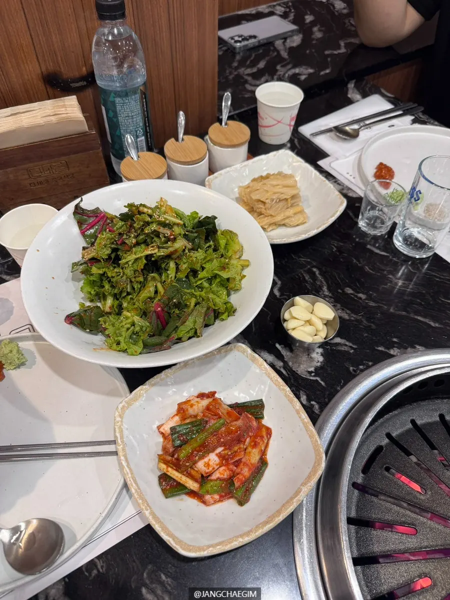 A neatly set table of side dishes