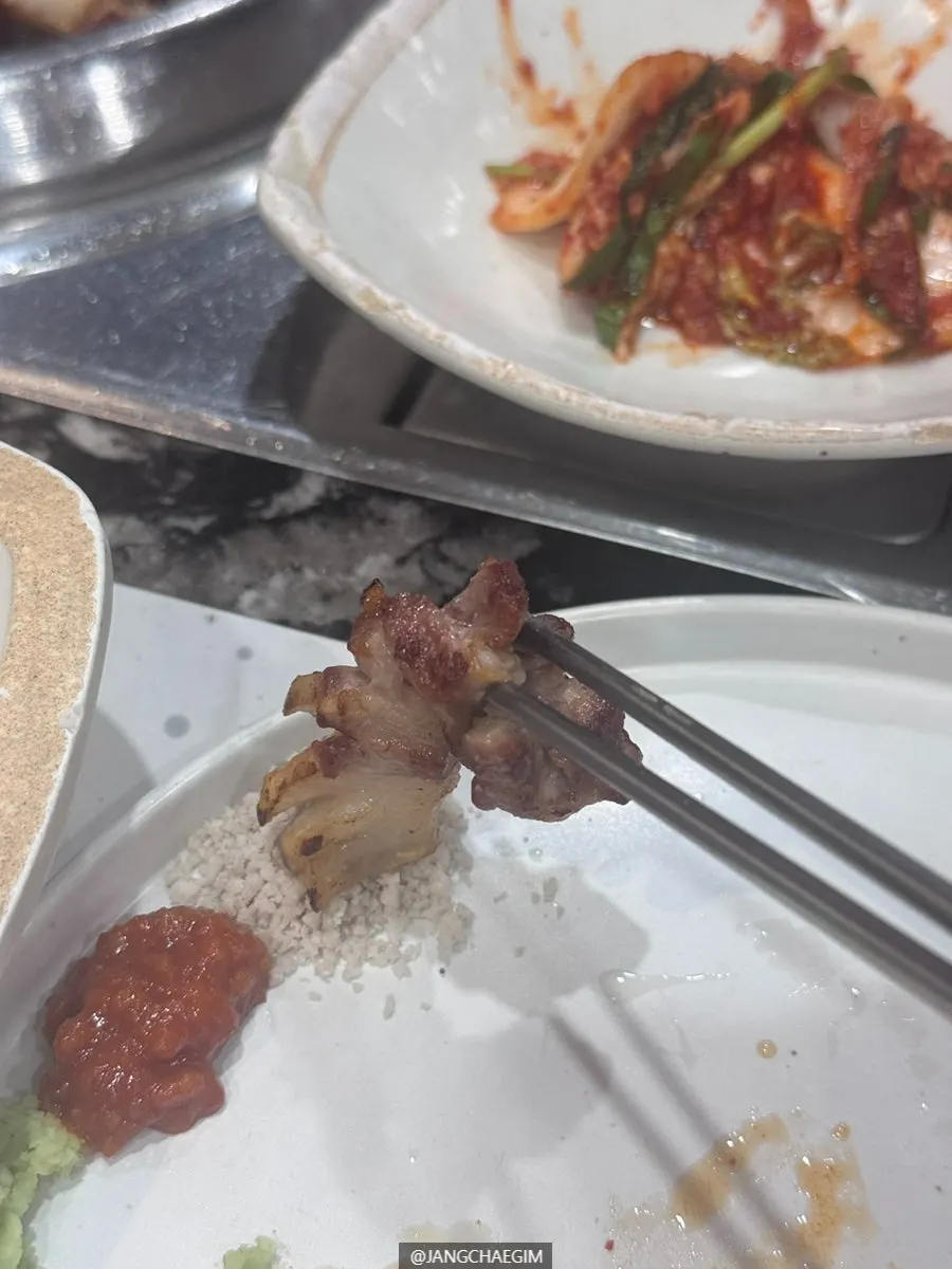 A piece of Jeju geungogi dipped in salt
