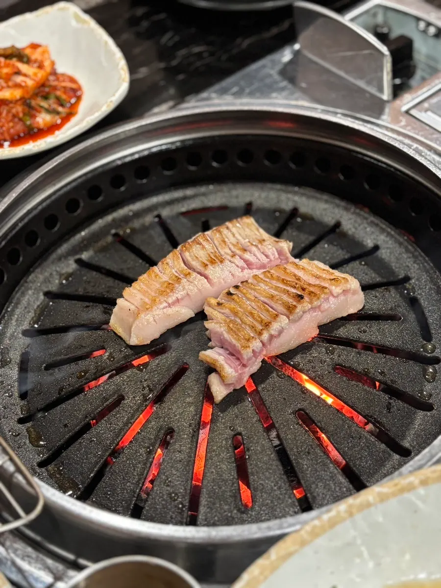 Hangjeongsal cooking on the grill