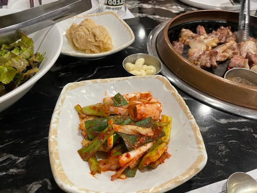 A full spread of side dishes set on the table