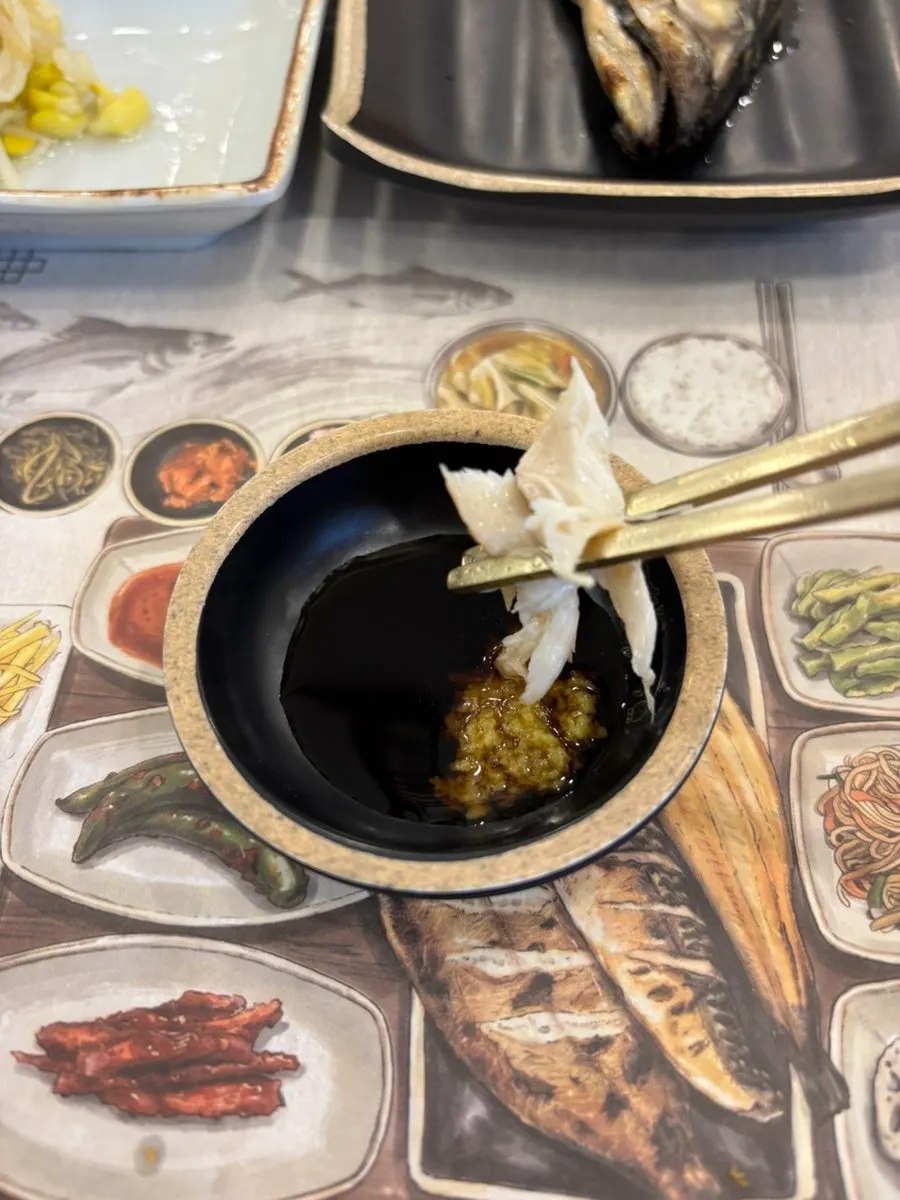 Thick flakes of mackerel pulled apart with chopsticks
