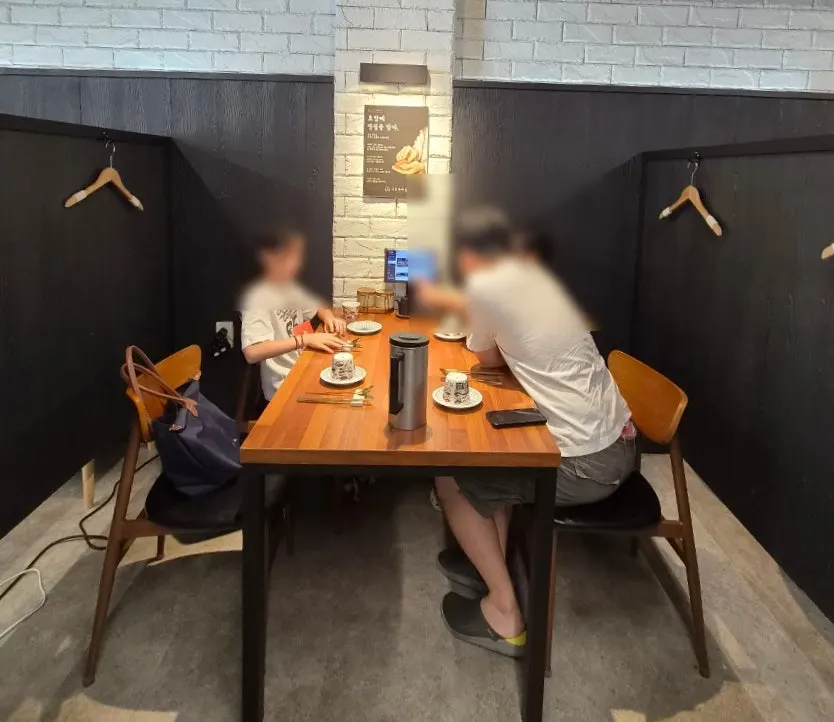 Private booth seating with partitions at Shirokuma
