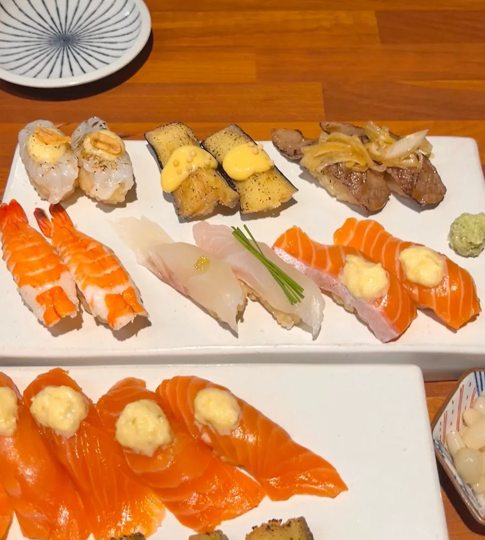 Close-up of sushi topped with sauce