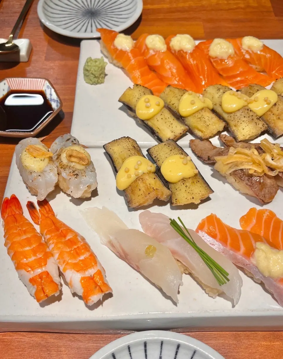 Plate with an assortment of different sushi types