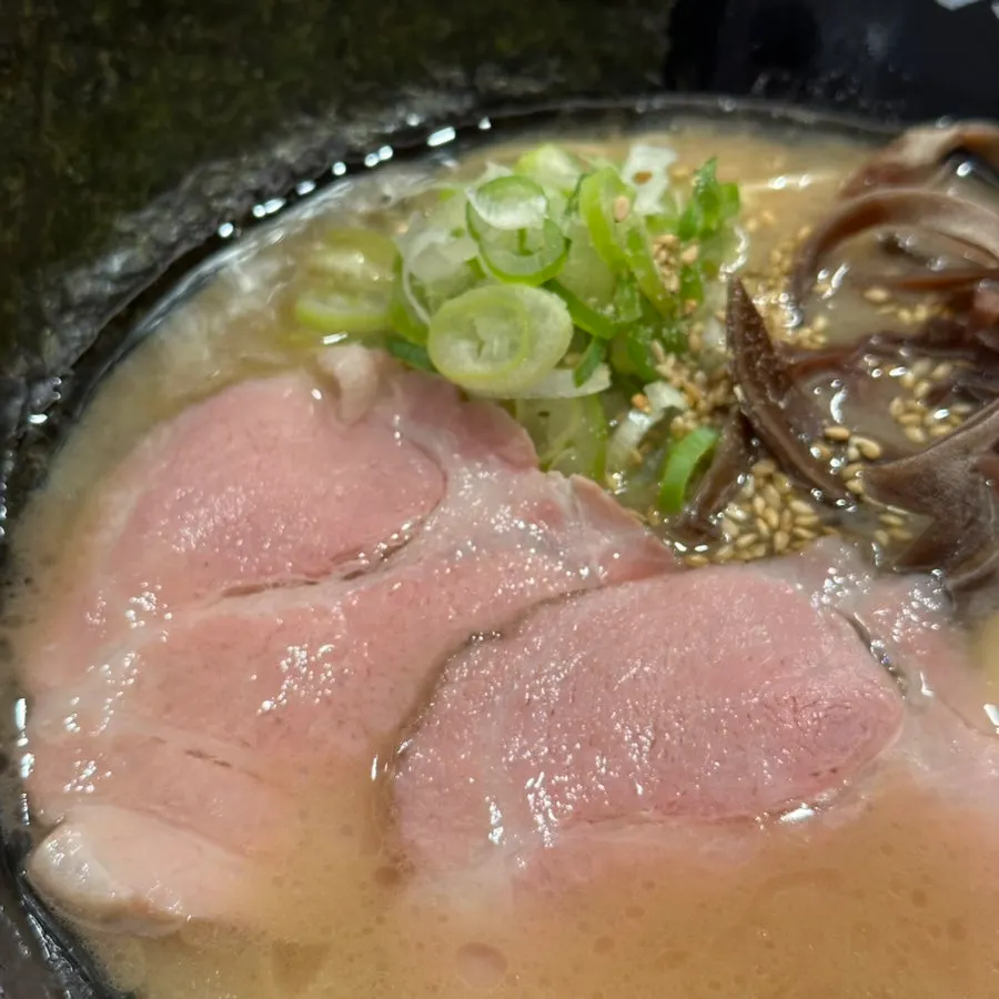 Tonkotsu ramen topped with chashu and a half egg