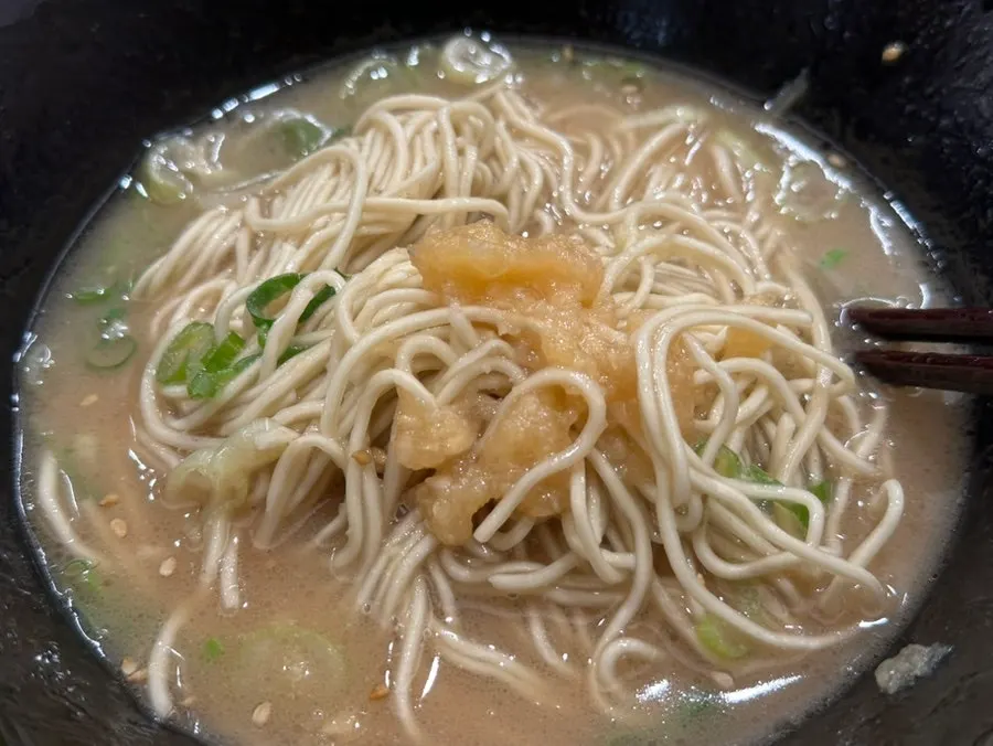Broth and spicy takana mixed into rice for eating