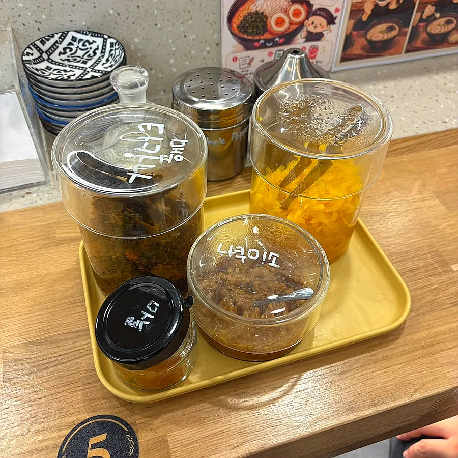 Tray with pickled radish, nakumiso, garlic, and spicy takana