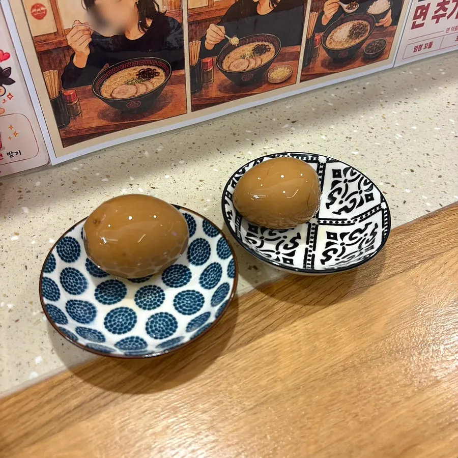 Extra ajitama served separately on a small plate