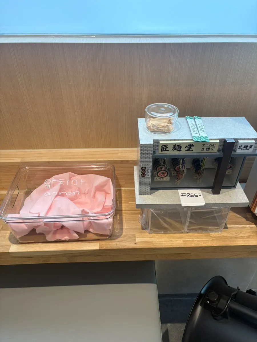 Self-service zone with aprons and mouthwash