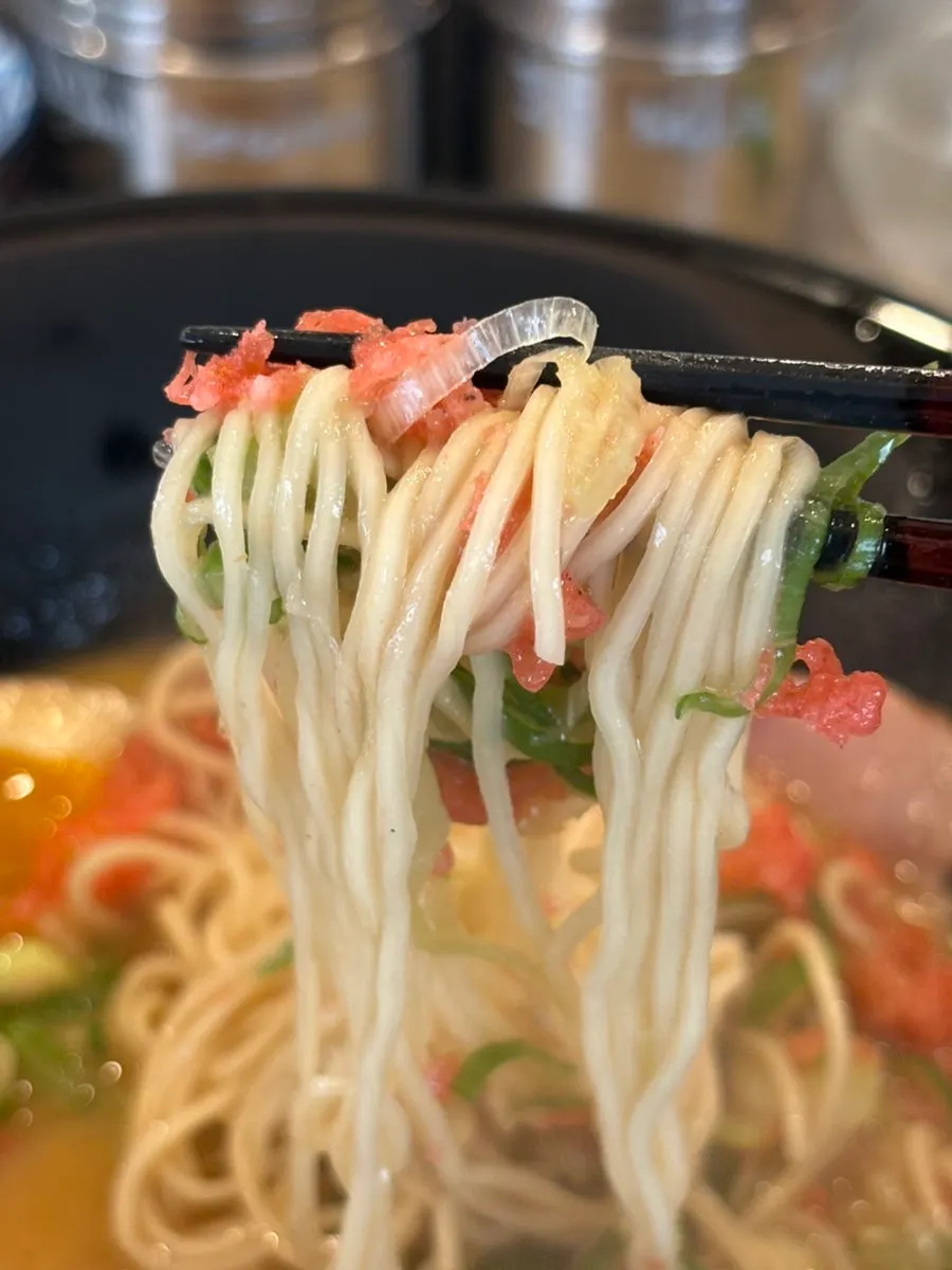 Thin noodles and rich broth of the shrimp tonkotsu