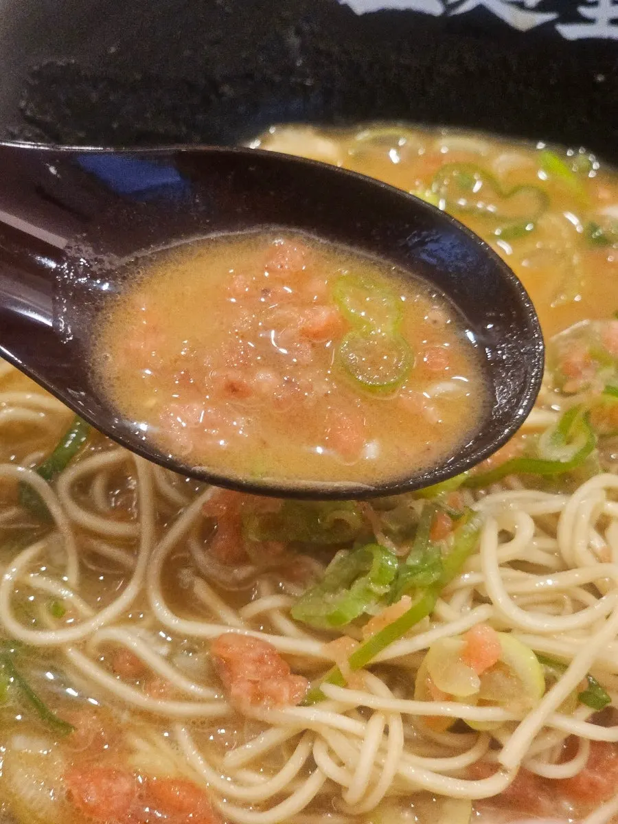 A spoonful of the rich tonkotsu broth