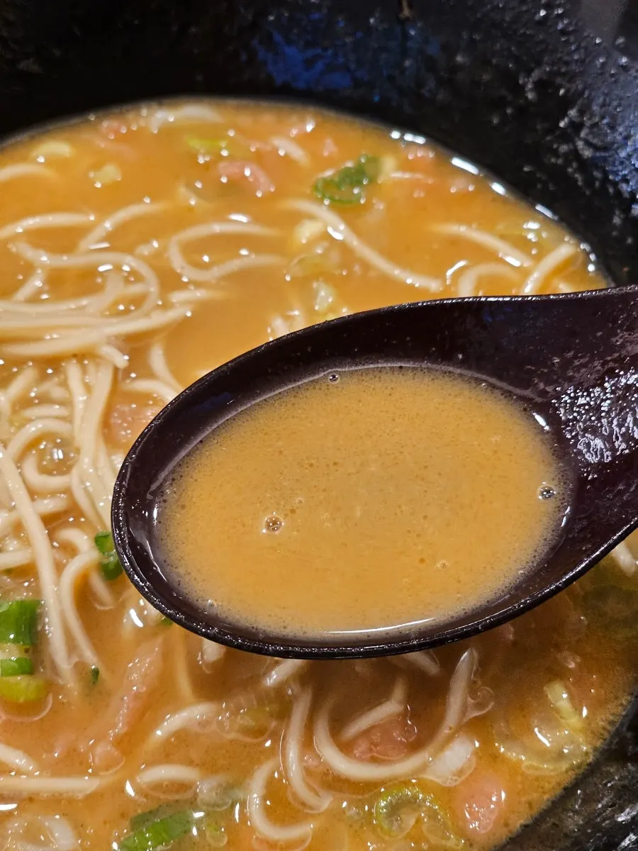 Tonkotsu broth stirred with garlic