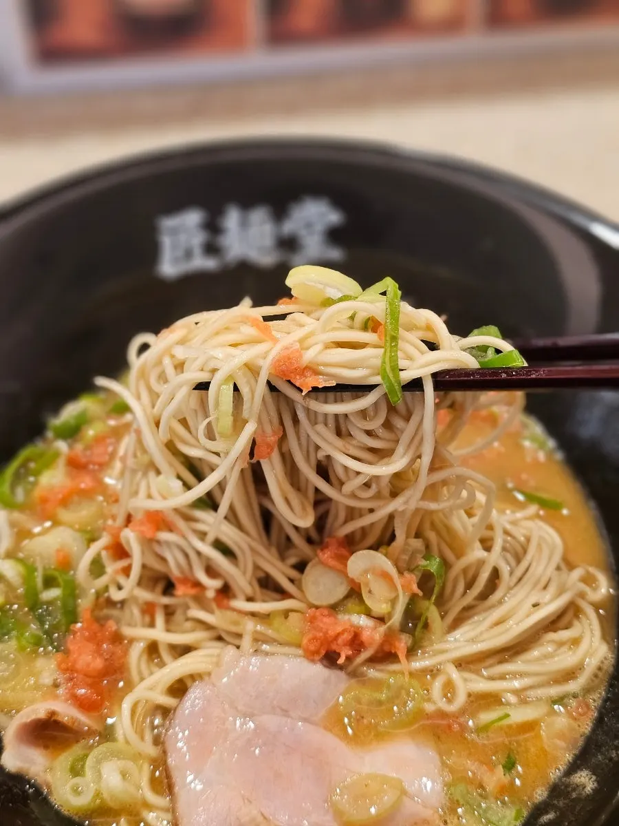 A nearly finished bowl of shrimp tonkotsu ramen