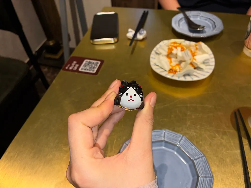 Close-up of a cat-shaped chopstick rest