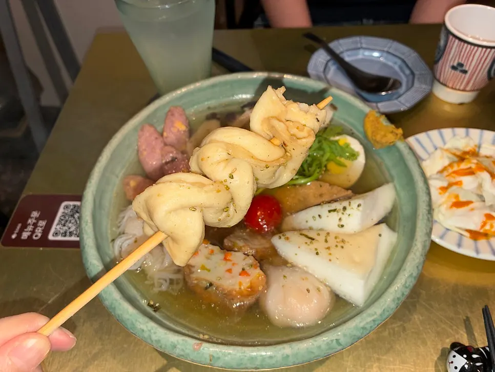 Spooning up the clear broth at Shunno Oden