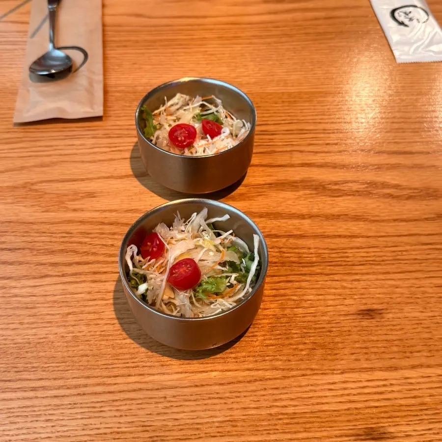 Broth soup and simple salad served as a starter