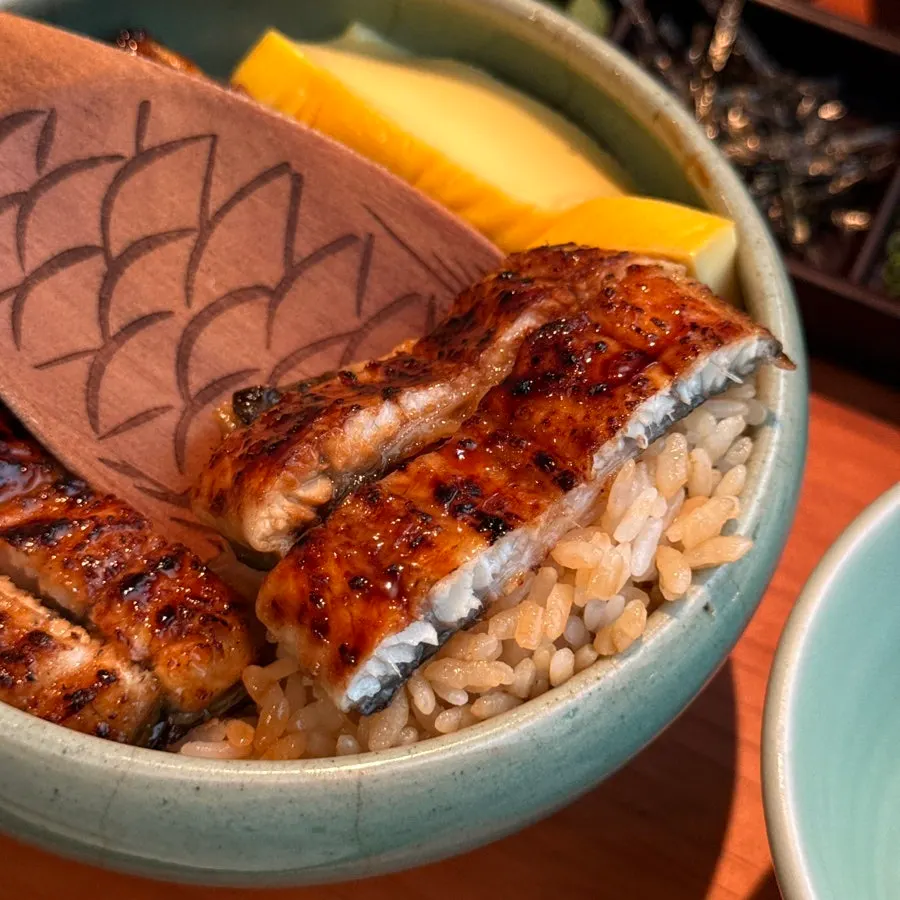 Glossy half portion of hitsumabushi eel rice bowl
