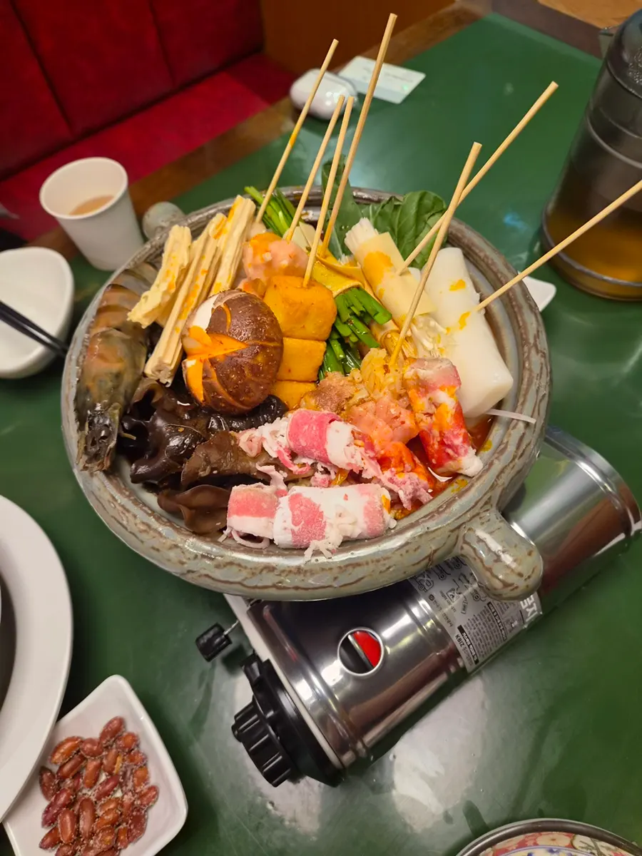 Huhuchwan mala hot pot with skewered ingredients