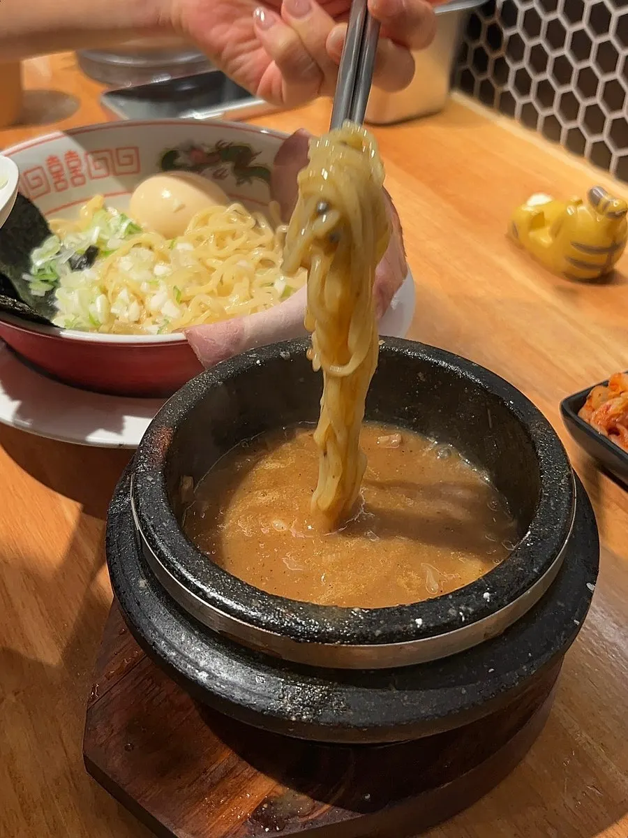 Dipping tsukemen noodles into the sauce