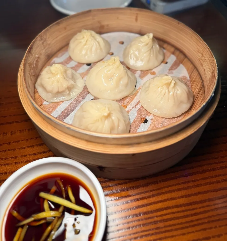 Xiaolongbao served in a steamer basket