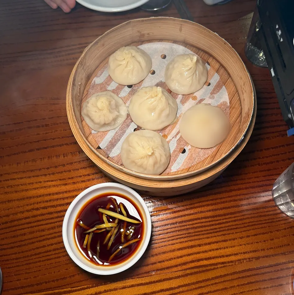 Xiaolongbao served with ginger soy sauce