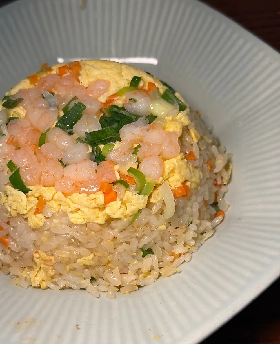 A spoonful of fluffy Chinese-style shrimp fried rice