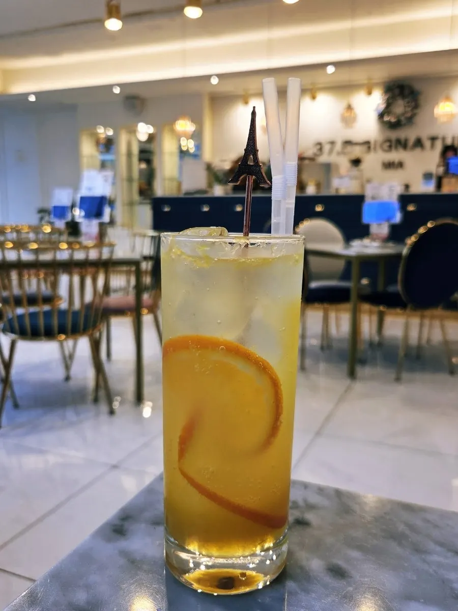 A glass of fresh-fruit orange ade