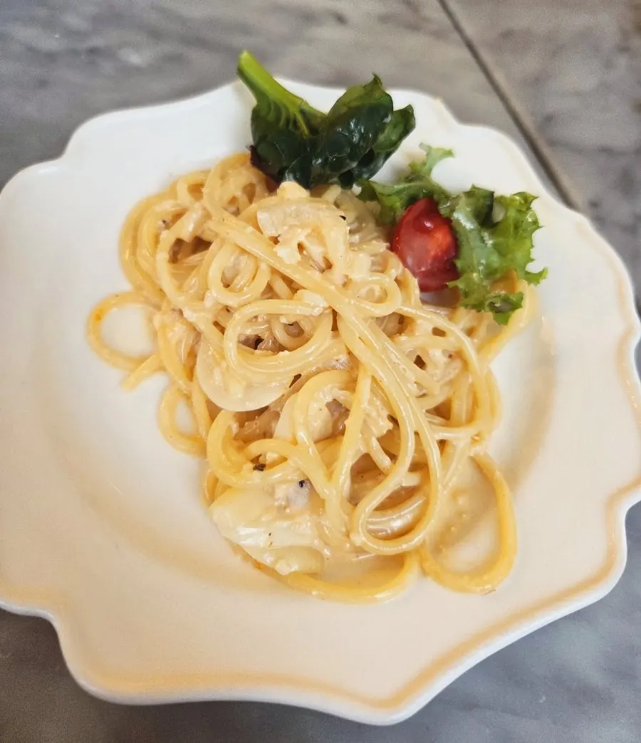 Myeongnan cream sauce served separately alongside the Mont Blanc bread