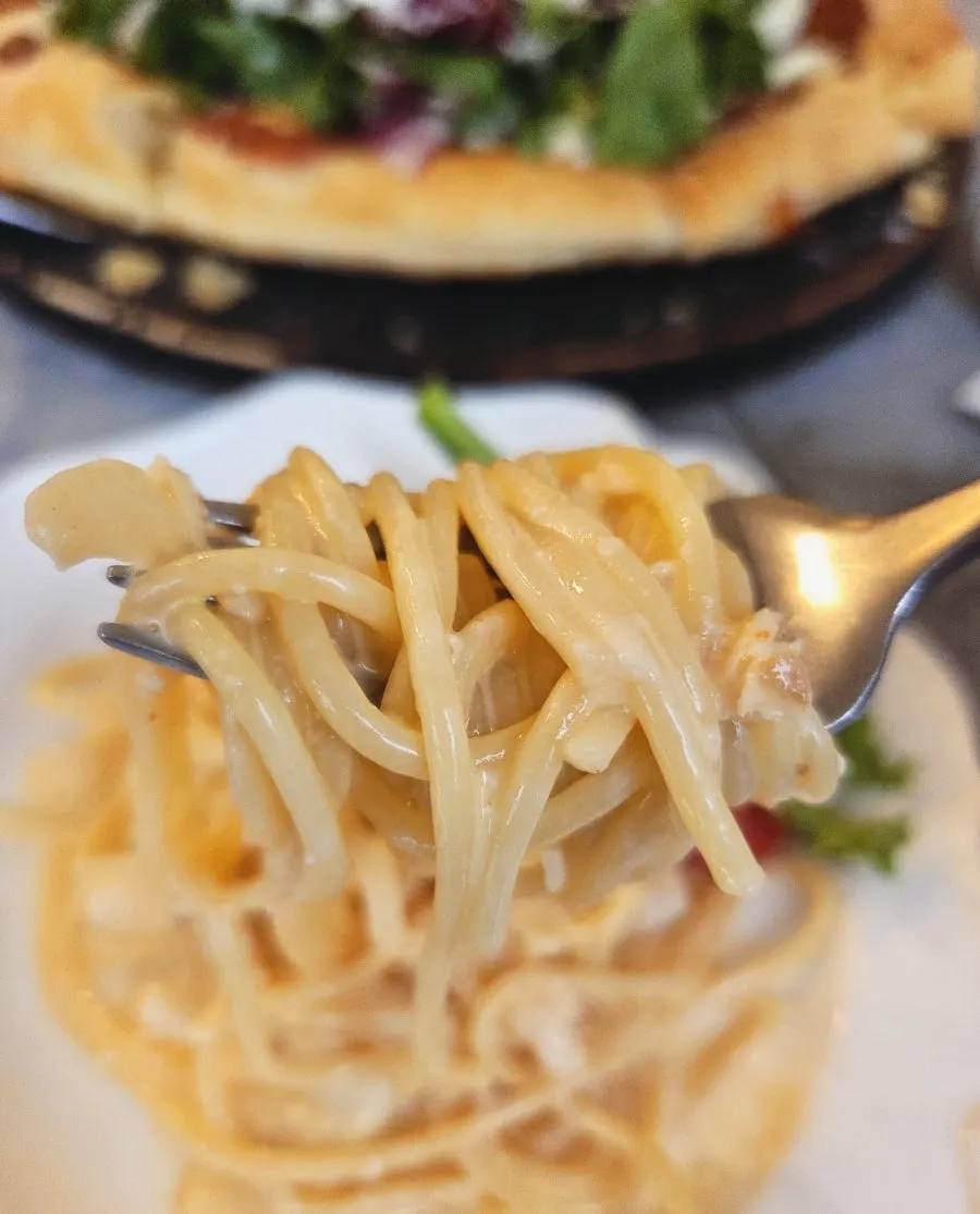 Pasta tossed in thick myeongnan cream sauce