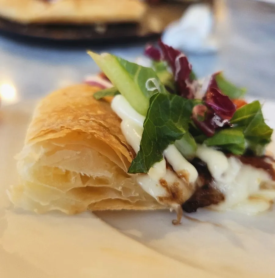 Ricotta salad pizza generously topped with salad