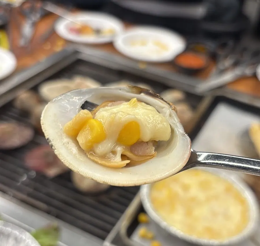 Scallops and sword razor clams topped with corn cheese