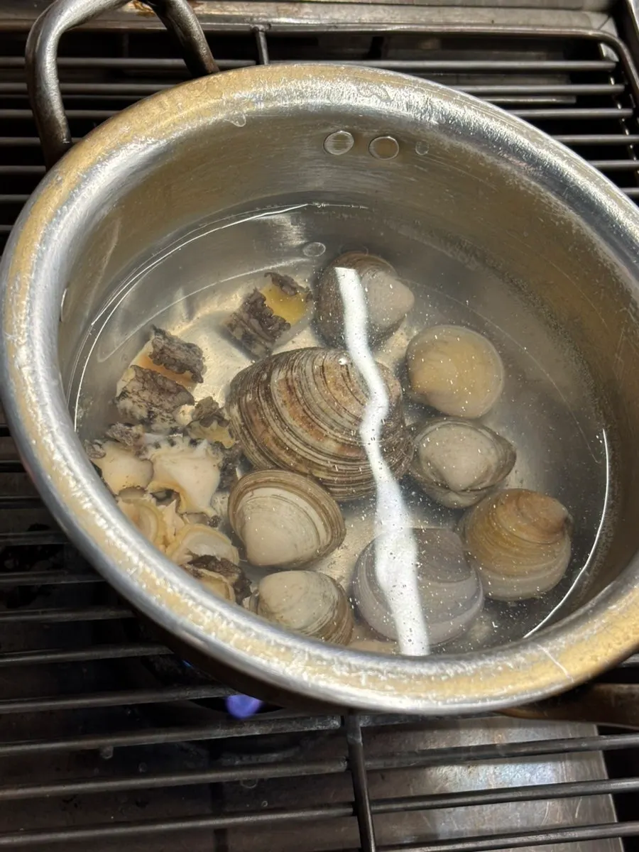 Shellfish steaming with the lid covered